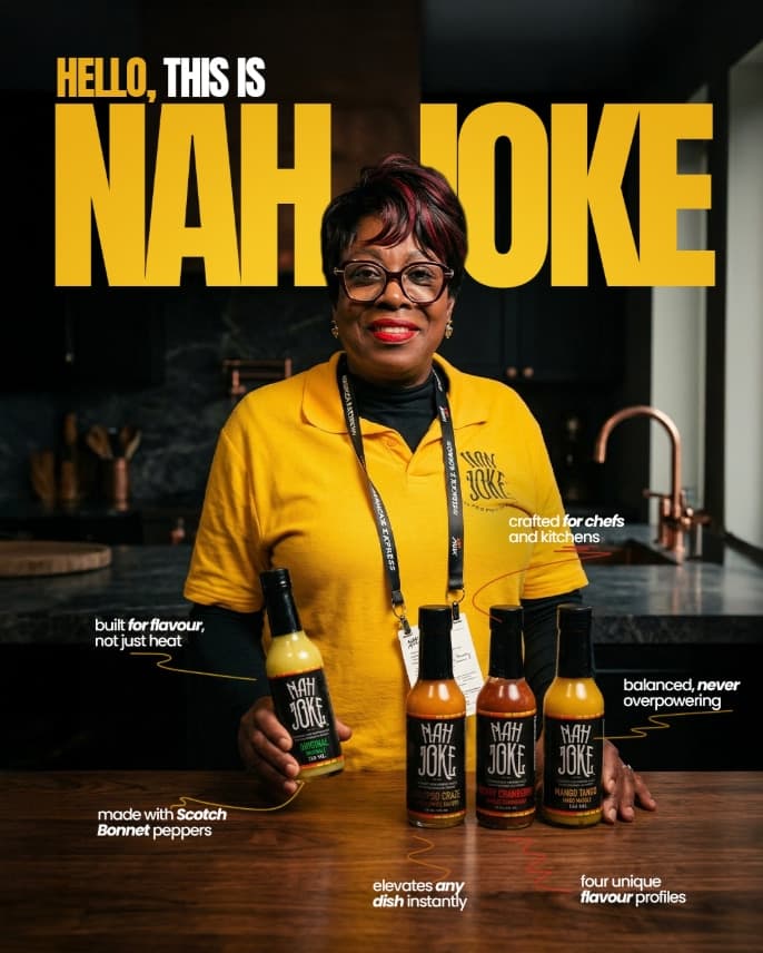 Nettie, founder of Nah Joke, in her kitchen with all four hot pepper sauce flavours